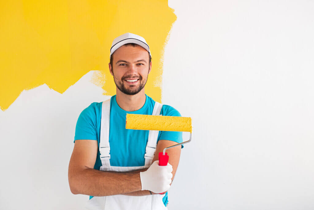 about us smiling man painting